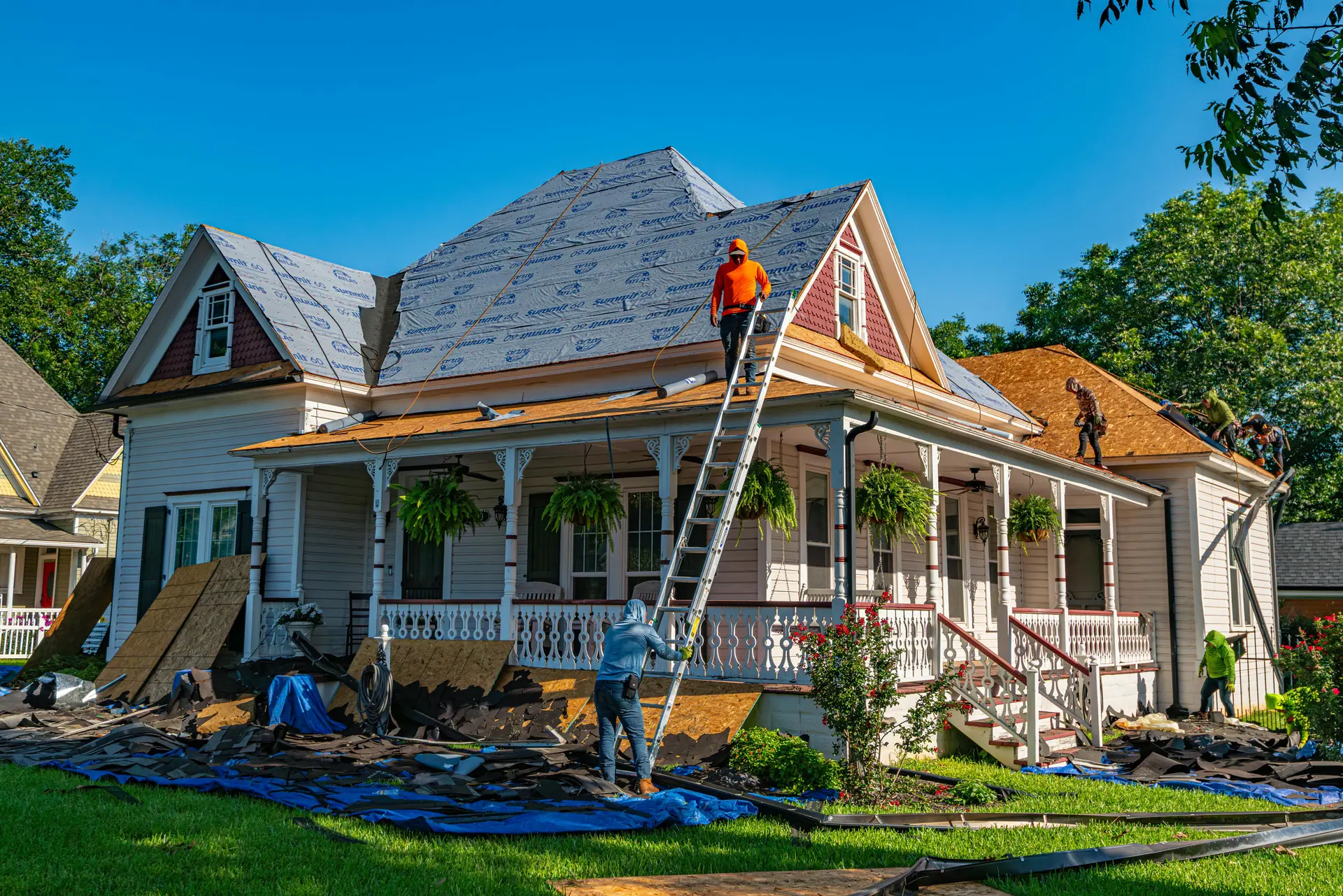 Roofing work in progress on a house